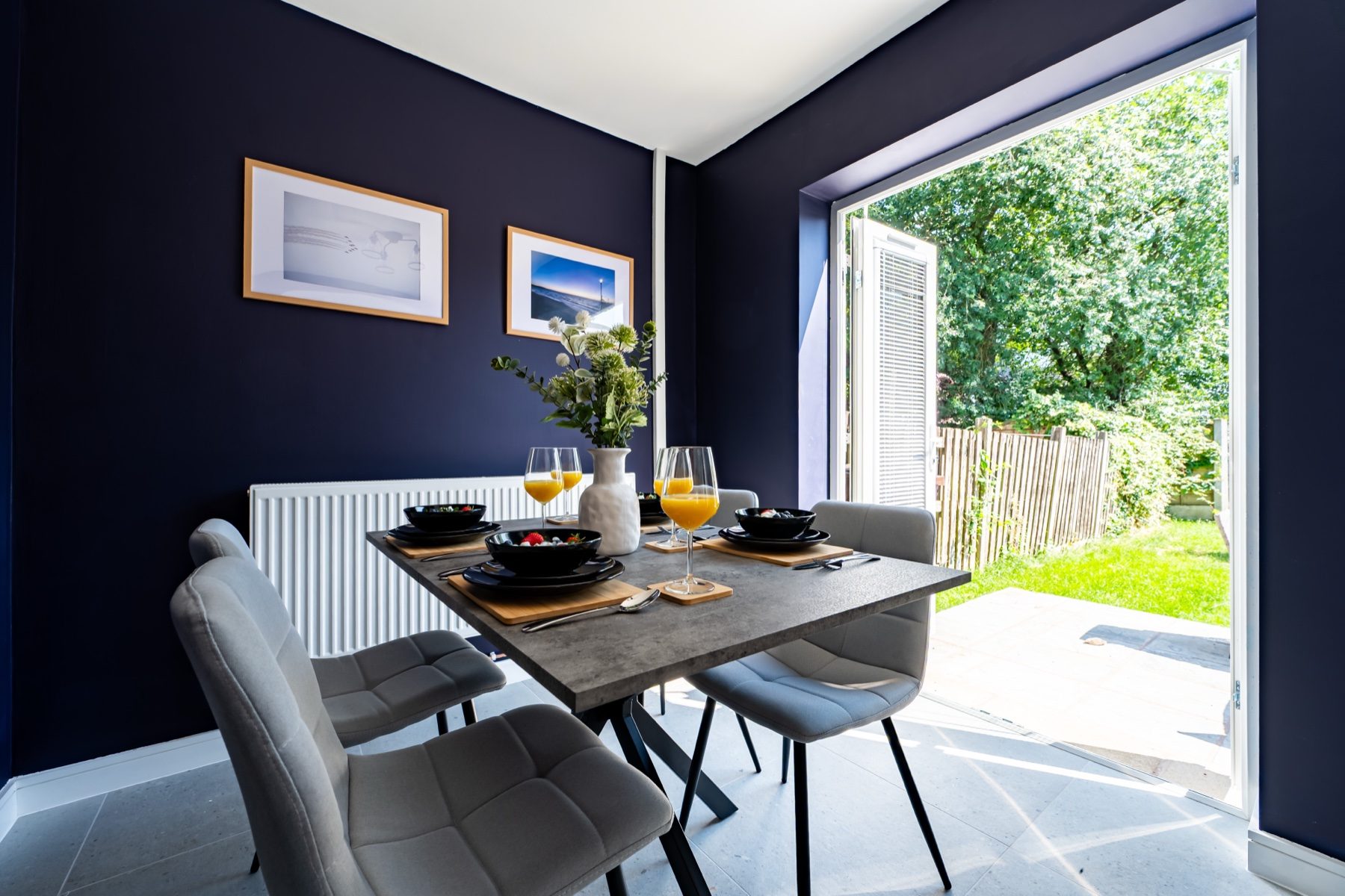 Lord Lodge dining room with table set beside patio doors