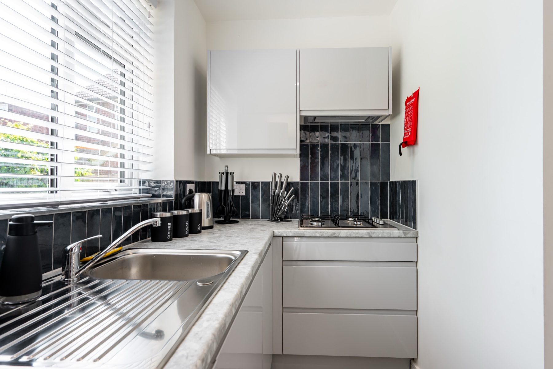 Lord Lodge kitchen sink and white cabinets
