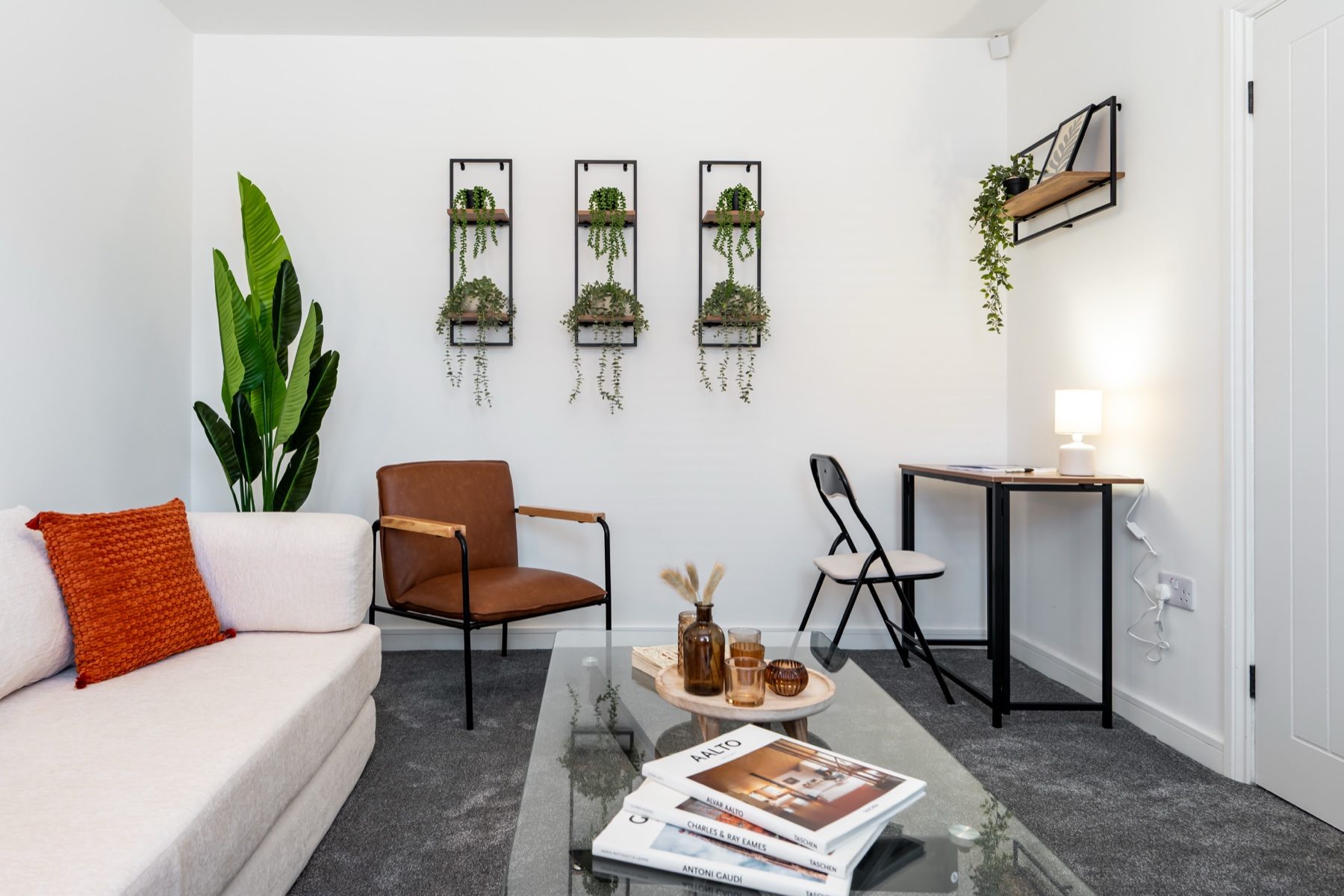 Lord Lodge lounge with sofa and small workspace